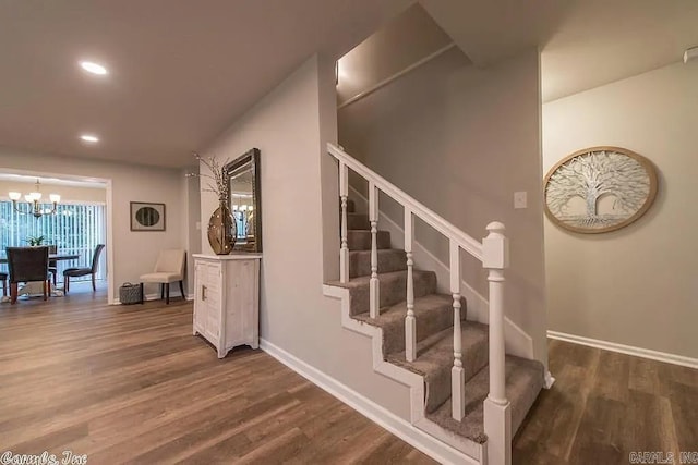 3808 John Harden Dr, Jacksonville, AR 72076 - staircase with recessed lighting, baseboards, a notable chandelier, and wood finished floors