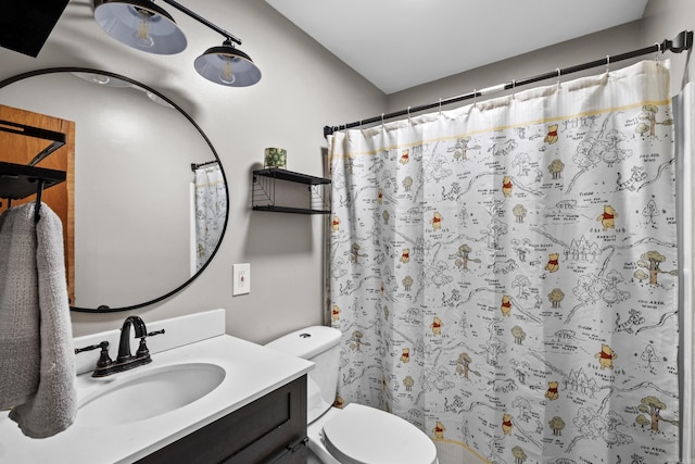 full bathroom with toilet, curtained shower, and vanity