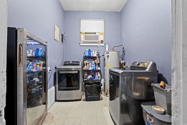 laundry area with laundry area, washing machine and dryer, gas water heater, and cooling unit