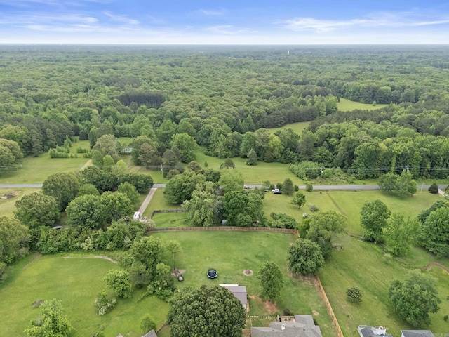 birds eye view of property with a wooded view