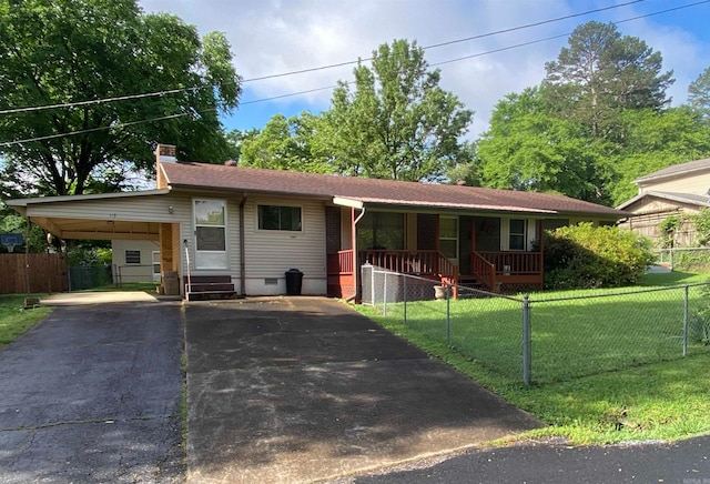 113 E Simpson St, Mount Ida, AR 71957 - ranch-style home with a chimney, a front lawn, a fenced front yard, and aphalt driveway