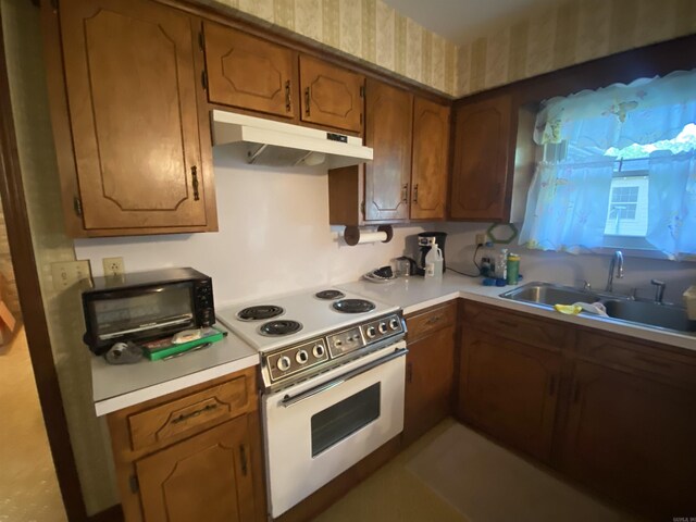 113 E Simpson St, Mount Ida, AR 71957 - kitchen featuring a sink, light countertops, white electric range, and under cabinet range hood