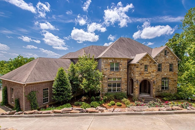 10 Lakewood Park Dr, North Little Rock, AR 72116 - view of front facade featuring roof with shingles and stone siding
