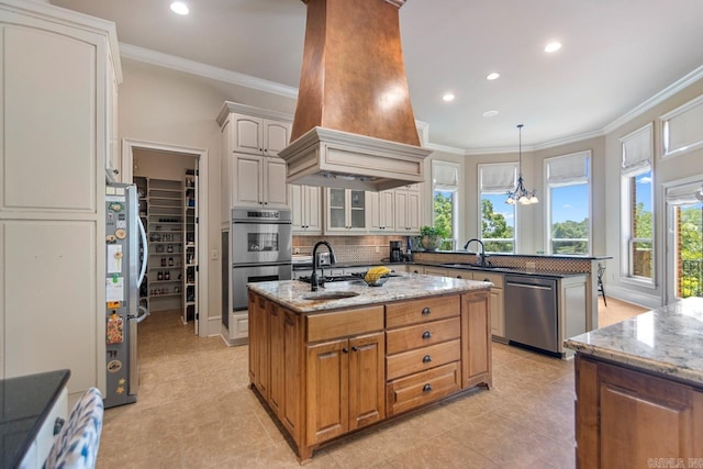 10 Lakewood Park Dr, North Little Rock, AR 72116 - kitchen with appliances with stainless steel finishes, decorative backsplash, a healthy amount of sunlight, and custom range hood