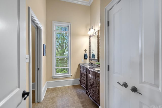 10 Lakewood Park Dr, North Little Rock, AR 72116 - bathroom with double vanity, a sink, baseboards, and a healthy amount of sunlight