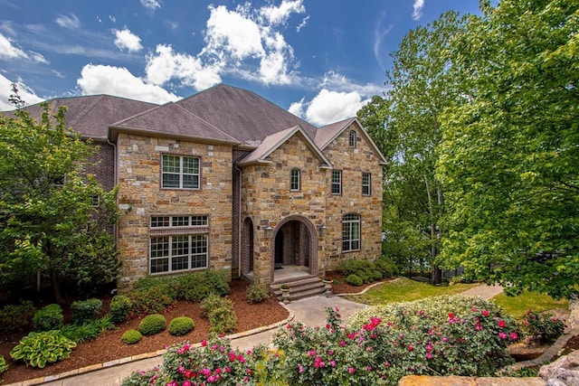 10 Lakewood Park Dr, North Little Rock, AR 72116 - view of front of home with a shingled roof and stone siding