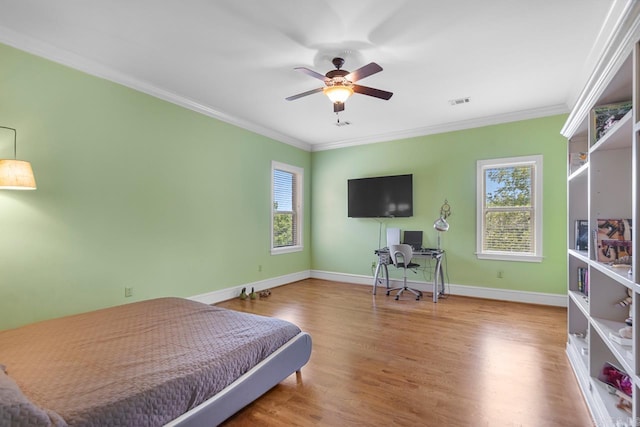 10 Lakewood Park Dr, North Little Rock, AR 72116 - bedroom with a ceiling fan, visible vents, crown molding, wood finished floors, and baseboards