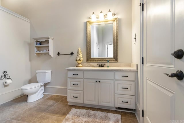10 Lakewood Park Dr, North Little Rock, AR 72116 - bathroom with toilet, baseboards, and vanity