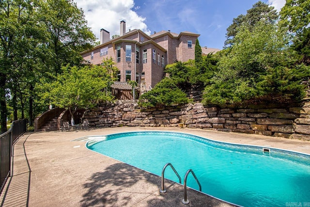 10 Lakewood Park Dr, North Little Rock, AR 72116 - outdoor pool with fence and a patio area