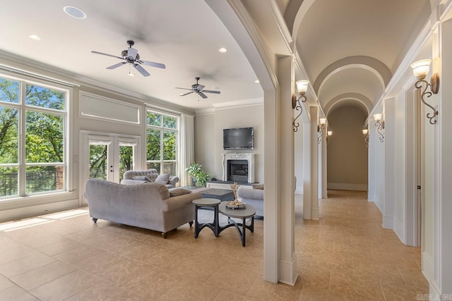 10 Lakewood Park Dr, North Little Rock, AR 72116 - living room with crown molding, arched walkways, a wealth of natural light, and french doors