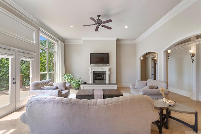 10 Lakewood Park Dr, North Little Rock, AR 72116 - living area with a ceiling fan, french doors, crown molding, arched walkways, and a premium fireplace