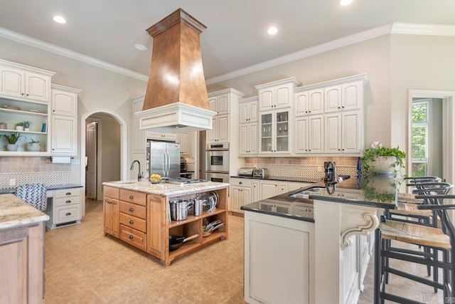 10 Lakewood Park Dr, North Little Rock, AR 72116 - kitchen featuring a sink, tasteful backsplash, open shelves, and stainless steel appliances