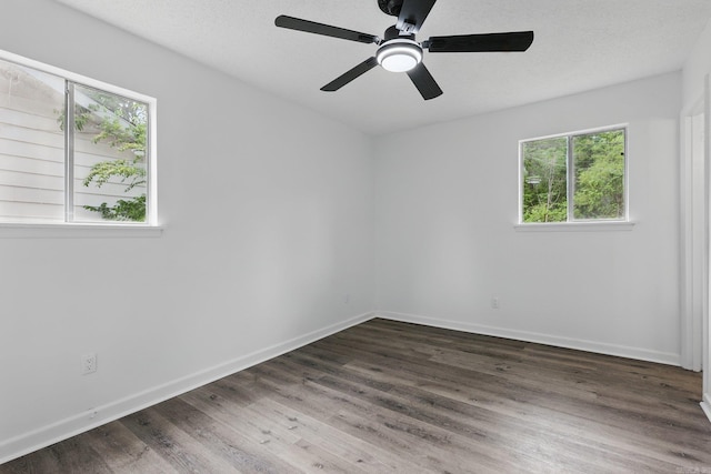 300 Dryad Ln, Little Rock, AR 72205 - unfurnished room featuring plenty of natural light, baseboards, and dark wood-type flooring