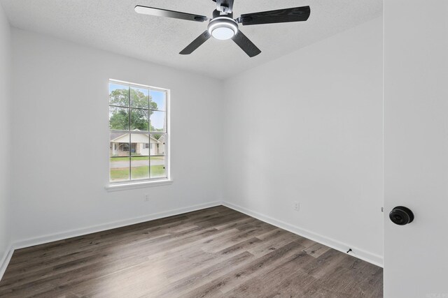 300 Dryad Ln, Little Rock, AR 72205 - spare room with a textured ceiling, baseboards, a ceiling fan, and wood finished floors
