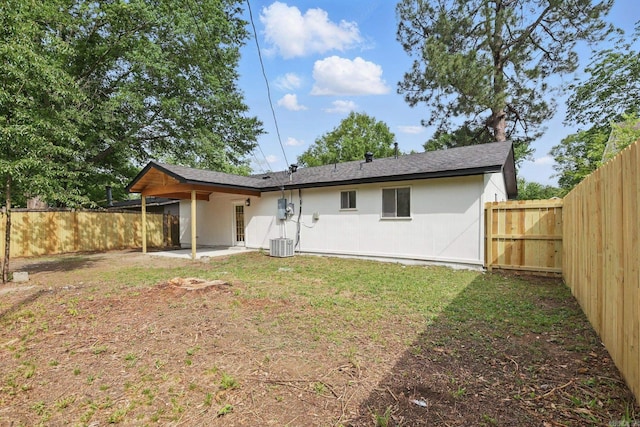 300 Dryad Ln, Little Rock, AR 72205 - rear view of house with a fenced backyard, central AC unit, a yard, and a patio area