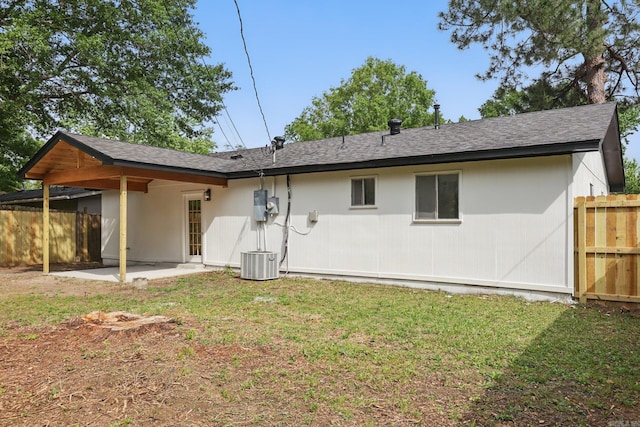 300 Dryad Ln, Little Rock, AR 72205 - back of property with fence, central AC, a shingled roof, a patio area, and a lawn
