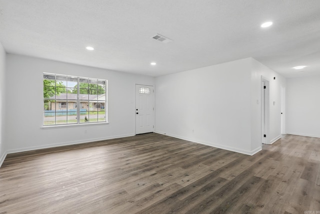 300 Dryad Ln, Little Rock, AR 72205 - unfurnished living room featuring visible vents, recessed lighting, baseboards, and wood finished floors