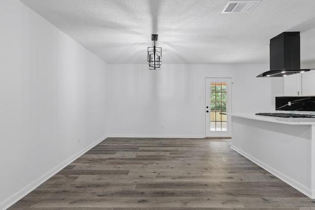 300 Dryad Ln, Little Rock, AR 72205 - unfurnished dining area featuring a textured ceiling, visible vents, baseboards, and dark wood-type flooring
