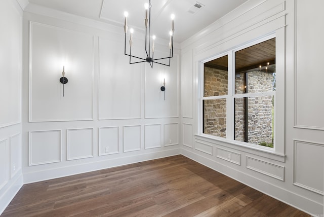 2940 Orchard View Dr, Conway, AR 72034 - unfurnished dining area with an inviting chandelier, dark wood finished floors, a decorative wall, and visible vents
