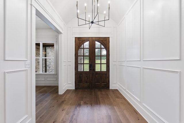 2940 Orchard View Dr, Conway, AR 72034 - foyer featuring lofted ceiling, a decorative wall, hardwood / wood-style floors, a chandelier, and french doors