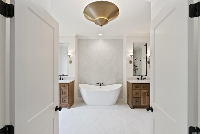 2940 Orchard View Dr, Conway, AR 72034 - bathroom featuring crown molding, a sink, marble finish floor, a freestanding tub, and two vanities