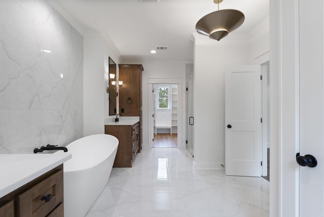2940 Orchard View Dr, Conway, AR 72034 - bathroom with a freestanding bath, vanity, marble finish floor, a shower stall, and ornamental molding