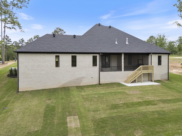 2940 Orchard View Dr, Conway, AR 72034 - rear view of property featuring stairway, roof with shingles, a sunroom, and a lawn