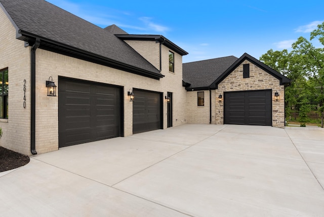 2940 Orchard View Dr, Conway, AR 72034 - view of front of property with a garage, a shingled roof, brick siding, and concrete driveway