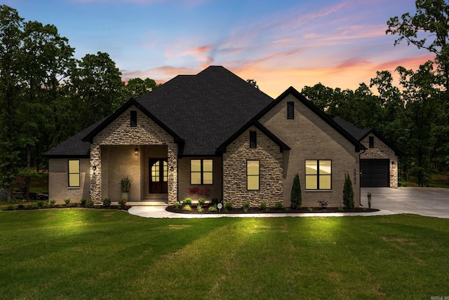 2940 Orchard View Dr, Conway, AR 72034 - view of front of property featuring a front yard, roof with shingles, driveway, and stone siding