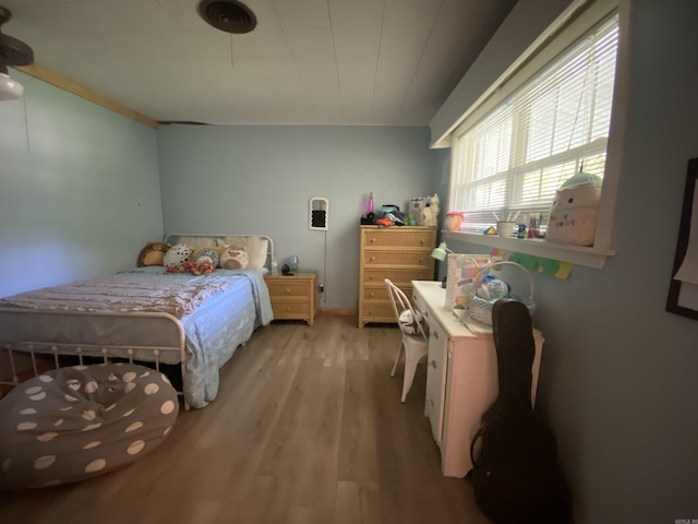 bedroom with wood finished floors