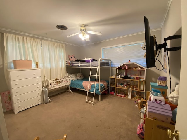 bedroom with crown molding, carpet floors, and a ceiling fan