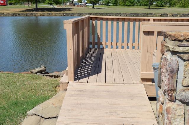 wooden terrace with a water view