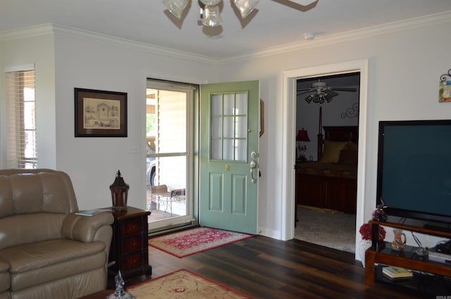 foyer entrance with crown molding, dark wood finished floors, ceiling fan, and a healthy amount of sunlight