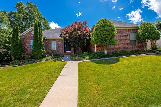 1 Sawgrass Ct, Little Rock, AR 72212 - view of front facade featuring brick siding, a shingled roof, and a front yard