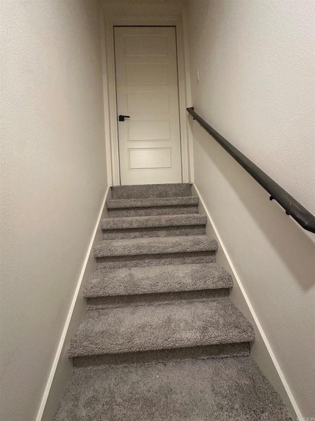 stairs featuring baseboards