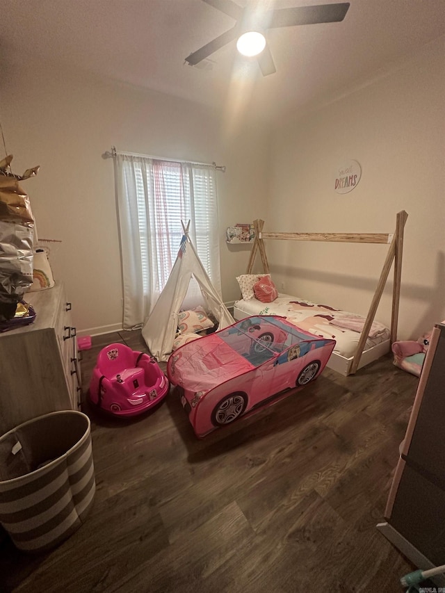 bedroom with a ceiling fan and wood finished floors