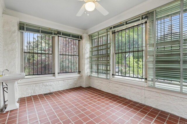 unfurnished sunroom with tile patterned flooring