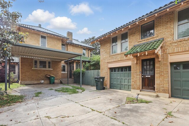 view of front of property featuring concrete driveway, brick siding, an attached garage, and entry steps