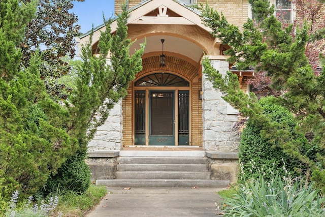 property entrance with stucco siding