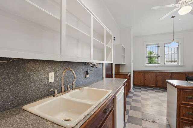 kitchen with white dishwasher, ceiling fan, a sink, light floors, and tasteful backsplash