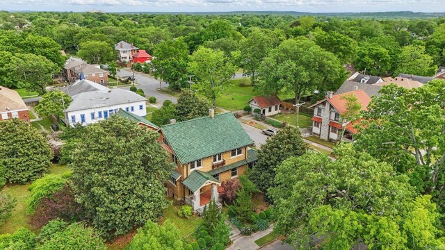 drone / aerial view with a residential view and a forest view