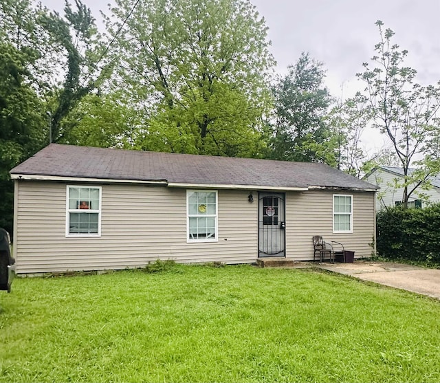 ranch-style house with a front lawn