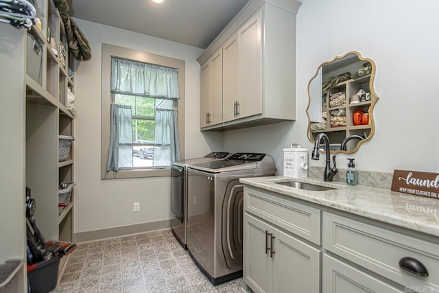 4201 Lovell Ln, Benton, AR 72019 - laundry room featuring a sink, baseboards, cabinet space, and washer and clothes dryer