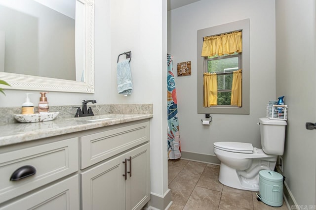 4201 Lovell Ln, Benton, AR 72019 - bathroom with baseboards, tile patterned flooring, vanity, and toilet
