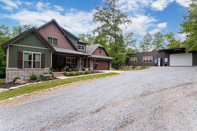 4201 Lovell Ln, Benton, AR 72019 - craftsman inspired home featuring a porch, board and batten siding, an attached garage, and driveway