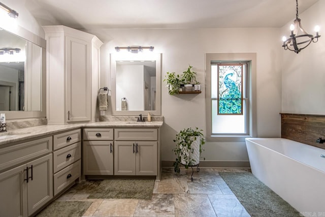 4201 Lovell Ln, Benton, AR 72019 - bathroom featuring double vanity, a soaking tub, a sink, and a chandelier