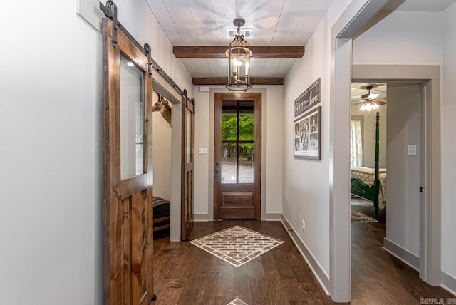 4201 Lovell Ln, Benton, AR 72019 - foyer entrance featuring baseboards, a barn door, dark wood finished floors, and beam ceiling