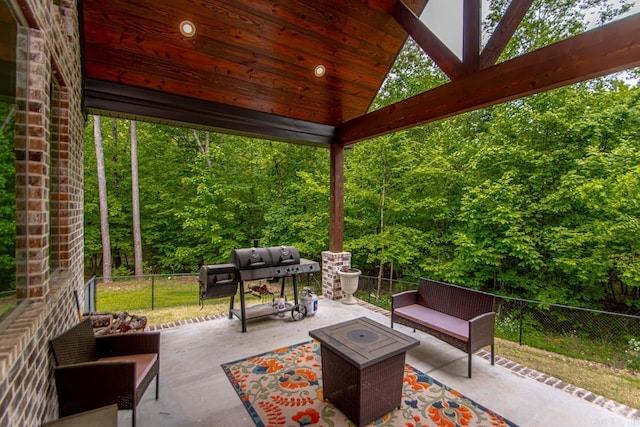 4201 Lovell Ln, Benton, AR 72019 - view of patio featuring a fenced backyard, a view of trees, an outdoor living space, and area for grilling