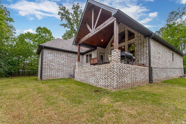 4201 Lovell Ln, Benton, AR 72019 - back of house featuring fence, a lawn, and brick siding