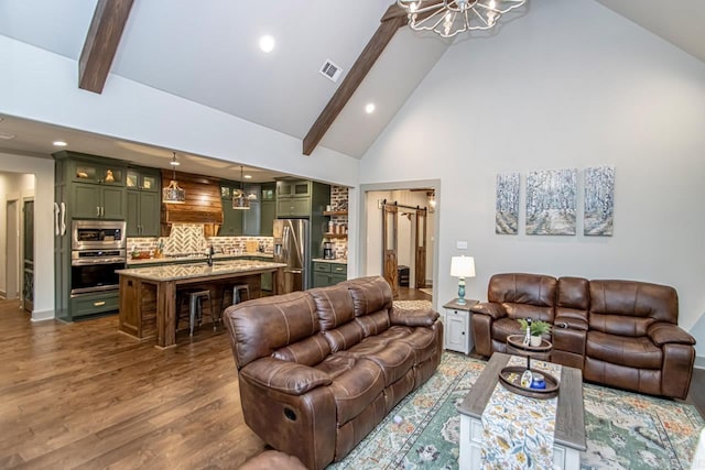 4201 Lovell Ln, Benton, AR 72019 - living room with dark wood-style flooring, a notable chandelier, beam ceiling, high vaulted ceiling, and visible vents